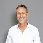 half body photo of Mark Hyman smiling
